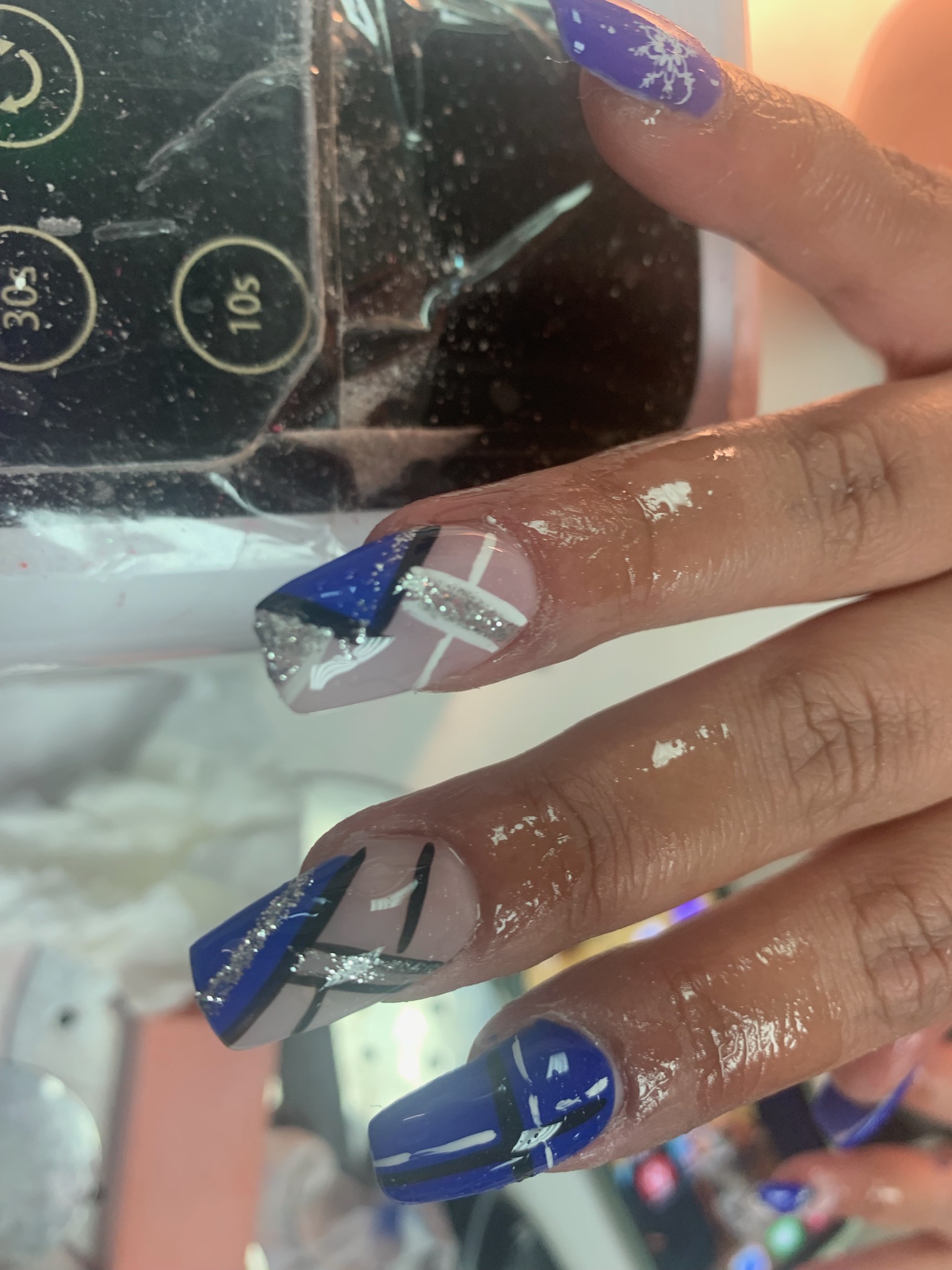 Royal blue geometric coffin nails with silver glitter