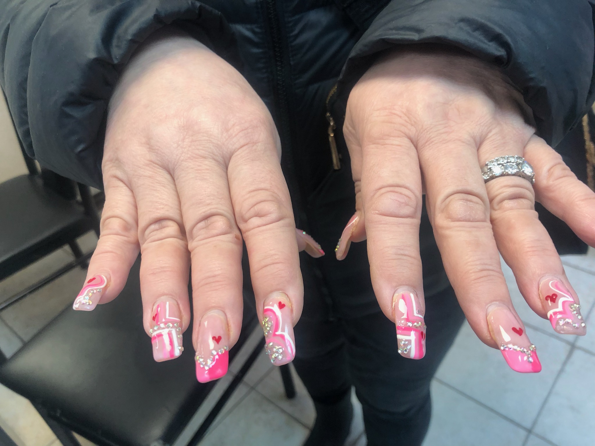Pink Valentine's hearts nail art with rhinestones