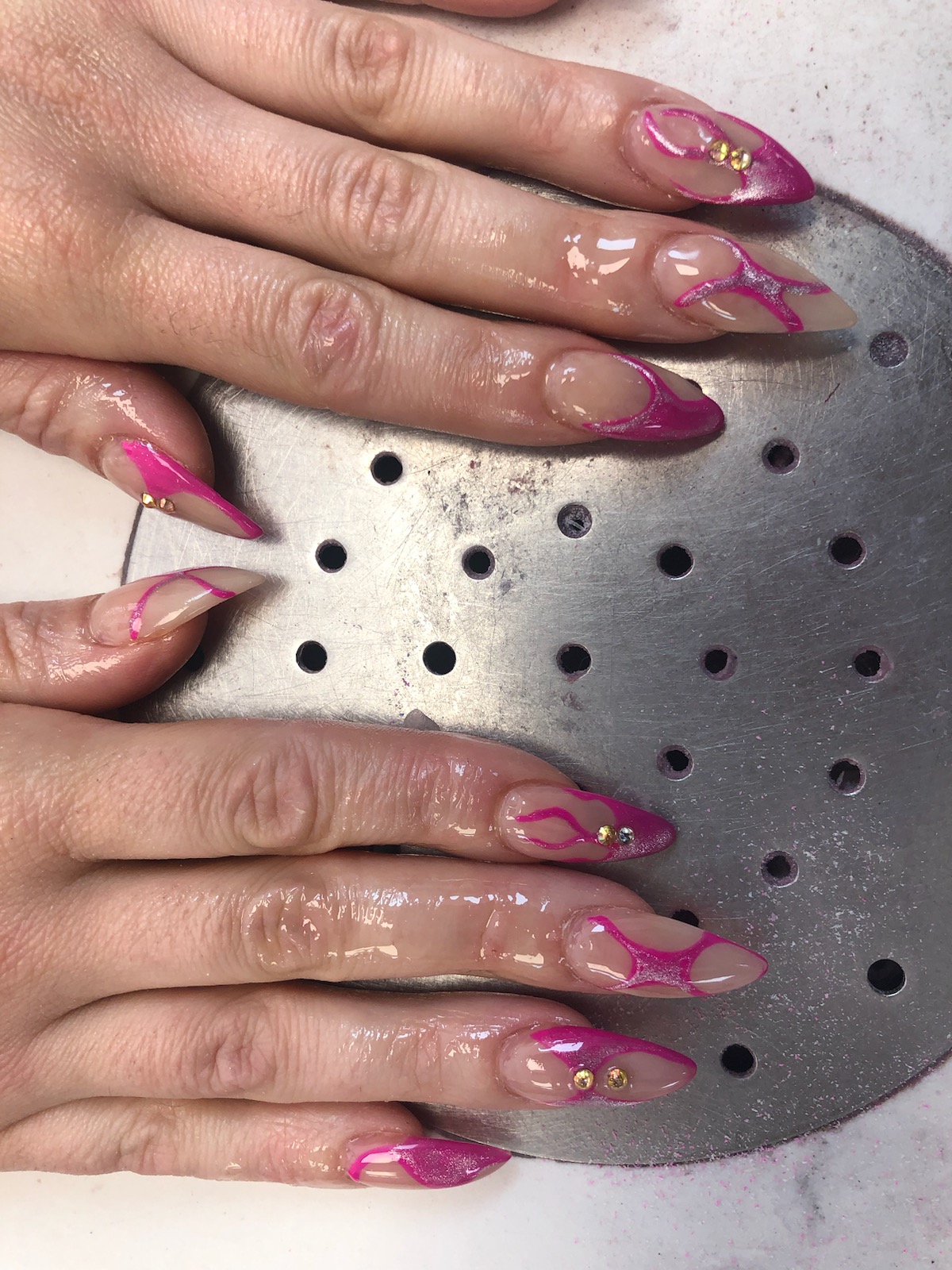 Nude nails with hot pink flame French tips