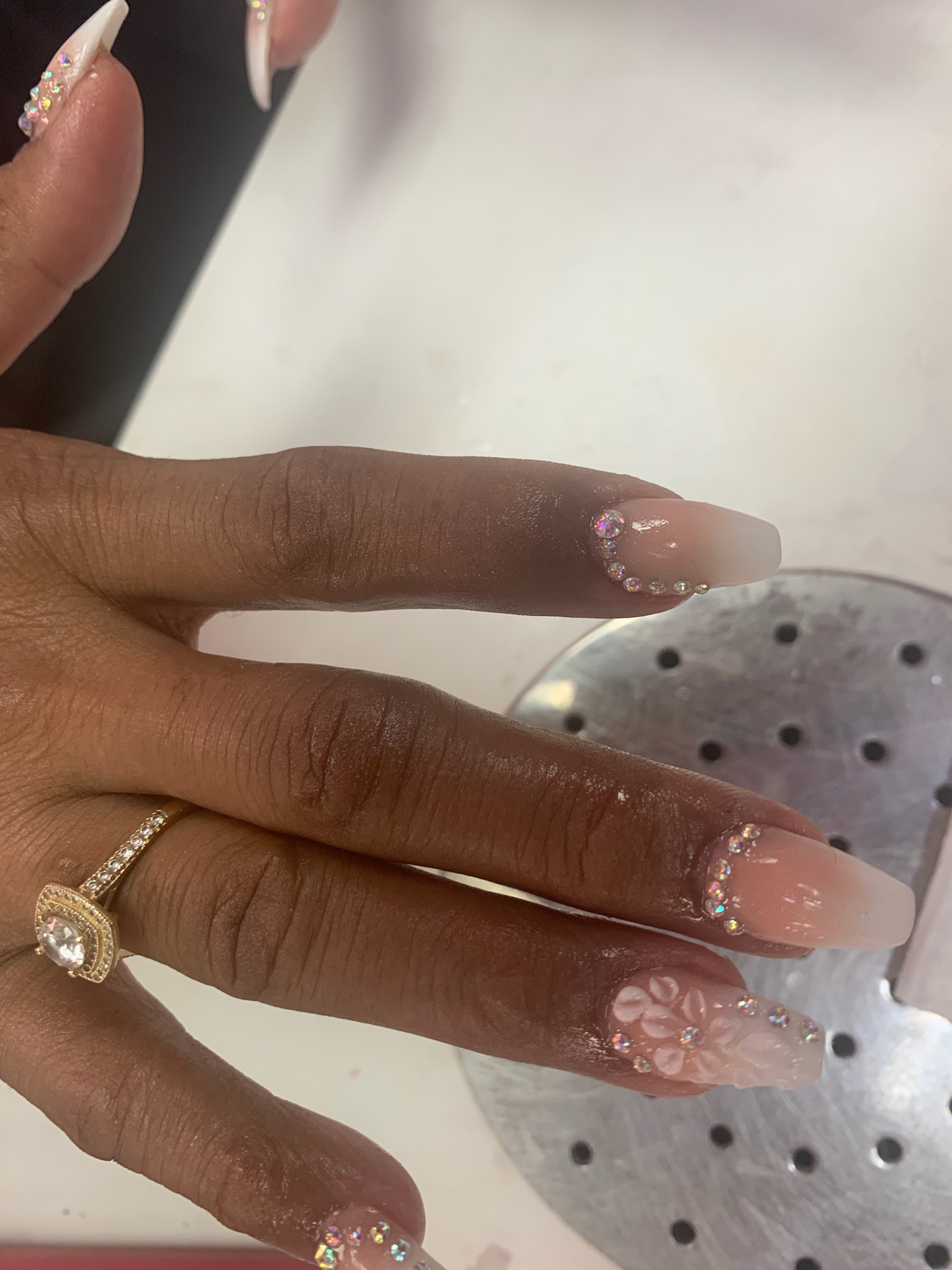 Black and emerald green stiletto nails with gold accents