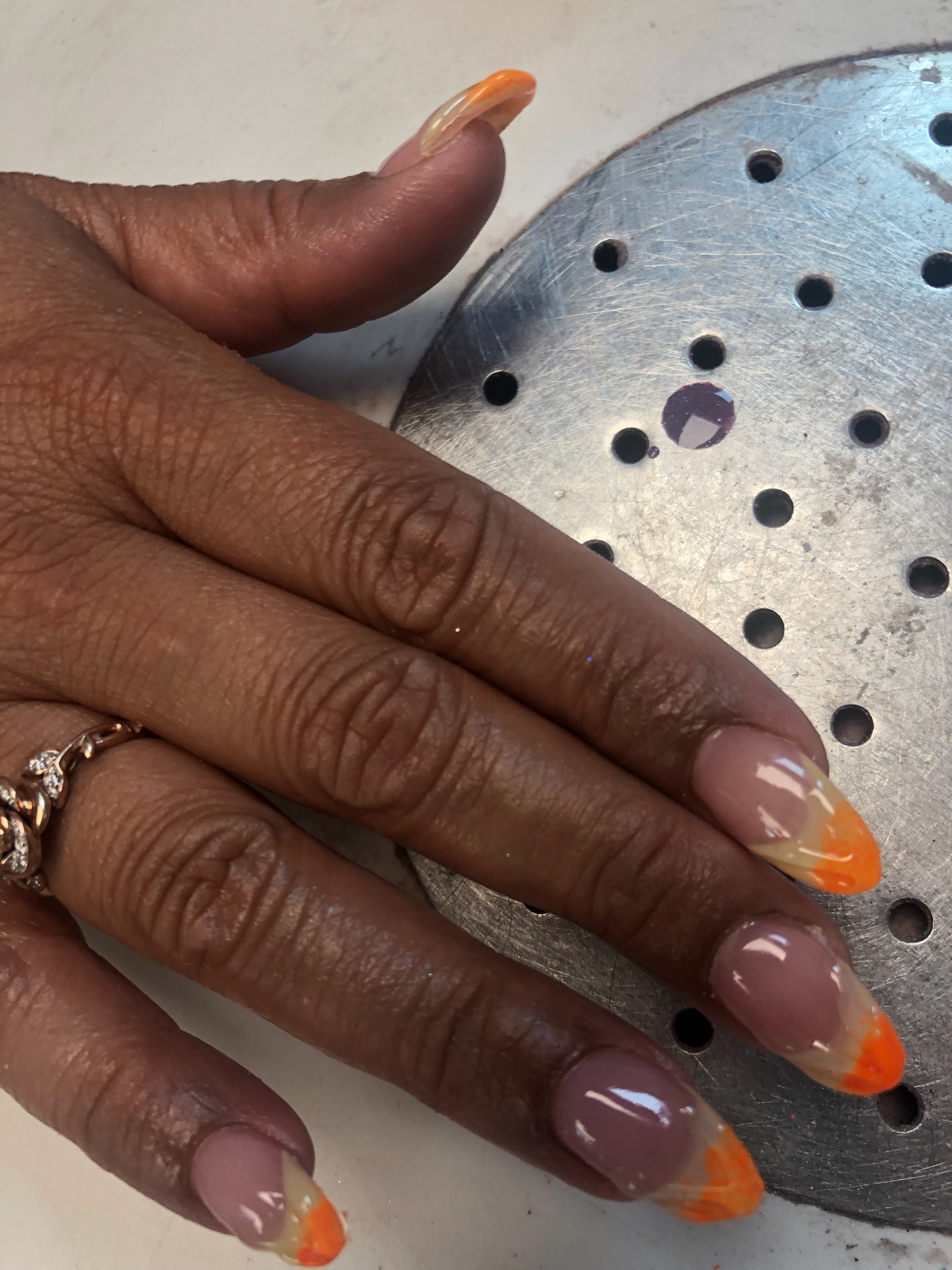 Orange French tip almond nails
