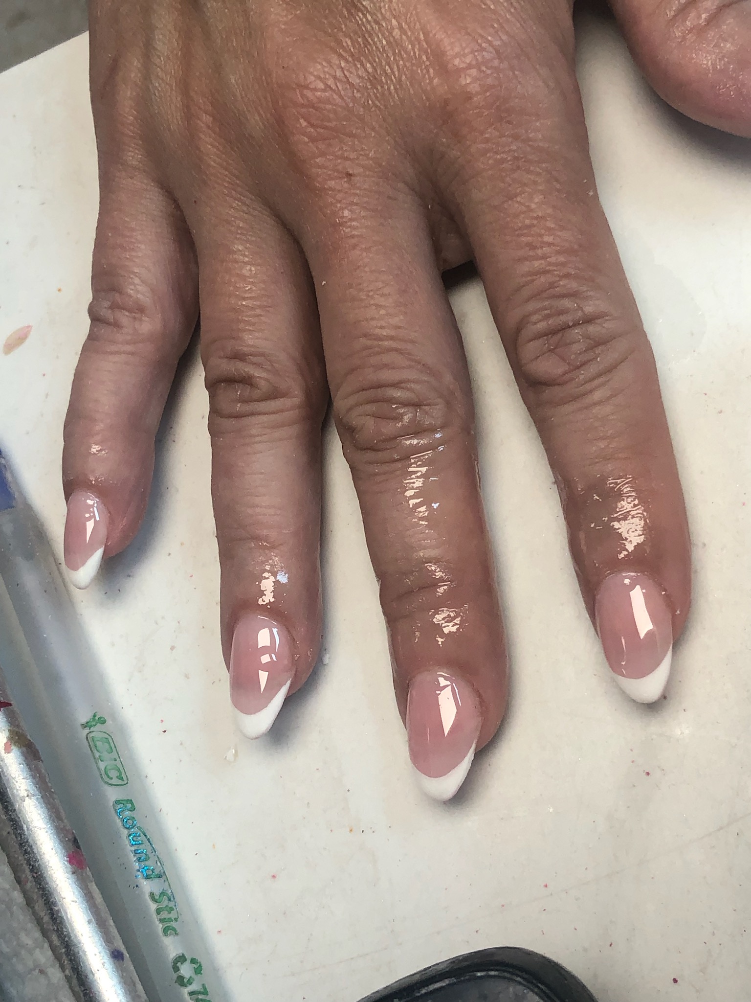 Almond nails with black tips and white 3D floral art
